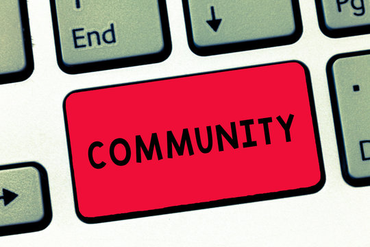 Text sign showing Community. Conceptual photo group living in same place or having characteristic in common Keyboard key Intention to create computer message, pressing keypad idea