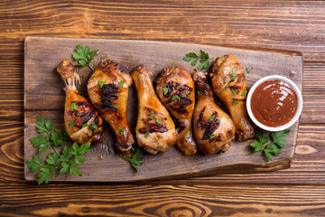 Grilled chicken legs with tomato sauce BBQ food background