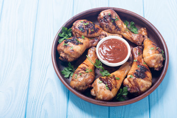 Grilled chicken legs with tomato sauce BBQ food background