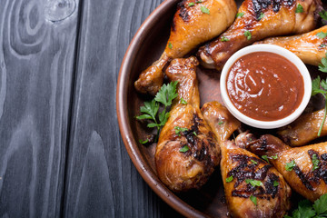 Grilled chicken legs with tomato sauce BBQ food background