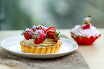 Tasty strawberry cream cake. Pastry. Sweet dessert on a plate