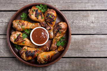 Grilled chicken legs with tomato sauce BBQ food background