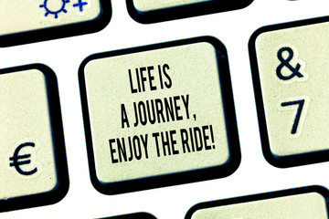 Conceptual hand writing showing Life Is A Journey Enjoy The Ride. Business photo text Enjoying things that happen everyday Keyboard key Intention to create computer message idea