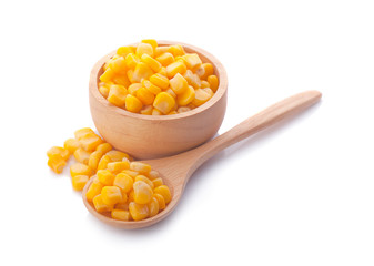 sweet corn in wooden bowl and spoon isolated on white background