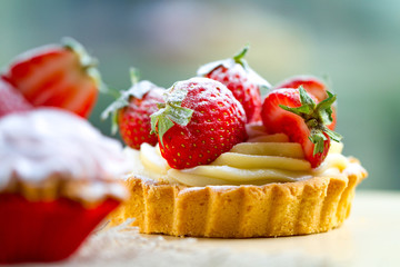 Tasty strawberry cake with cream and fresh strawberries. Pastry. Sweet dessert