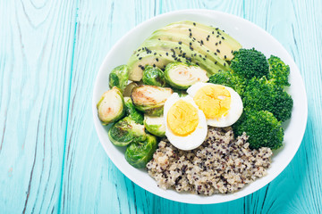 Buddha bowl with quinoa , eggs , avocado , brussels sprouts and broccoli