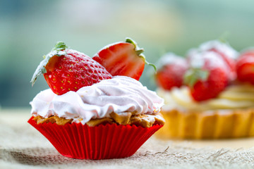 Tasty strawberry cake with cream and fresh strawberries. Pastry. Sweet dessert