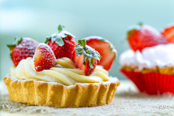 Tasty strawberry cake with whipped cream and with fresh strawberries. Pastry. Sweet dessert