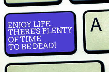 Text sign showing Enjoy Life There S Is Plenty Of Time To Be Dead. Conceptual photo Be happy while you are alive Keyboard key Intention to create computer message, pressing keypad idea