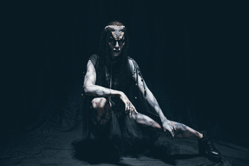 A young woman in the image of a humanoid and extraterrestrial alien. © Stanislav