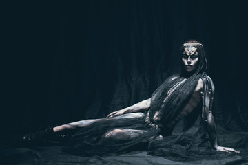 A young woman in the image of a humanoid and extraterrestrial alien. © Stanislav