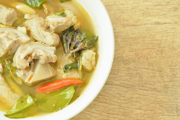 hot and spicy pork bone with tamarind and Thai herbs soup on bowl