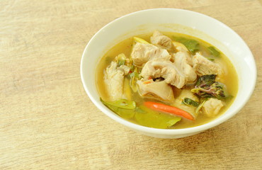 hot and spicy pork bone with tamarind and Thai herbs soup on bowl