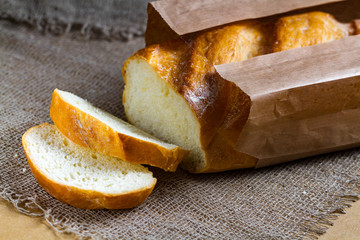 Long loaf from the bakery on the table. Bakery products. Bread from rye, wheat flour