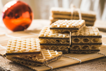 Delicious waffles on the festive wooden table