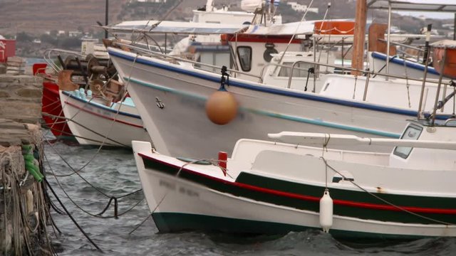 Lockdown: Docked Fishing Boats Rocking in Rough Waters