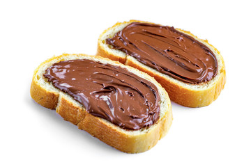Isolated pieces of loaf with chocolate paste spread on a white background. Sandwiches with nut paste on a breakfast