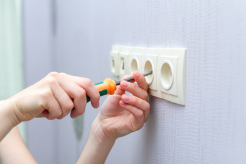 Repair wall sockets with a screwdriver