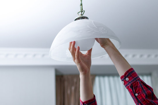 Replacement Of The Used LED Bulb In The Chandelier In The House