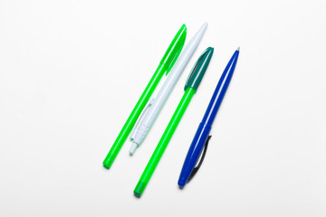 different colors pens isolated on the white background