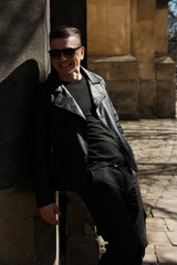 man in sunglasses on the background of architecture
