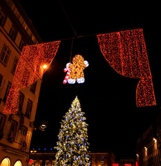 Strasbourg Capital of Christmas. Noel illumination garlands in shape of Gingerbread man and Christmas tree.