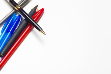 different colors pens isolated on the white background