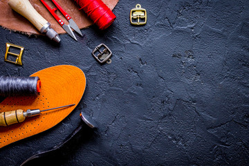 leather craft instruments on dark background top view mock up