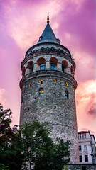 Galata Tower at purple night. Historical building or structure in Istanbul, Turkey. Beautiful view of old Galata Tower in twilight. One of the most famous and top rated tourist attraction in Istanbul.