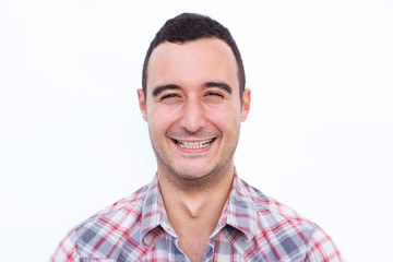 Close up smiling latin man against isolated white background