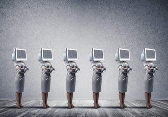 Business women with monitors instead of head.