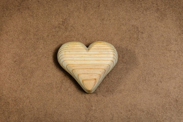 Obraz premium Wooden heart on old paper. Concept for Valentine's day greeting card