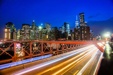 Fototapeta na wymiar Buildings and transportation on Brooklyn bridge in night New York.