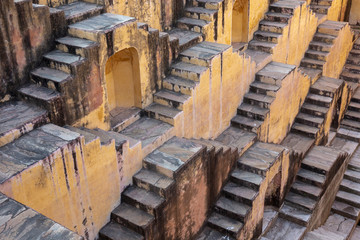 the stepwells of Chand Baori, in Jaipur, India. It was built as a monument to the goddess of joy and happiness, Hashat Mata