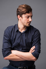 Studio portrait of young man on a dark background