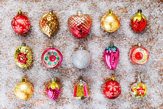 Pattern of antique Christmas toys on a Board covered with frost