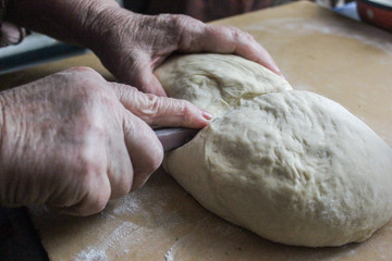 hands kneading dough