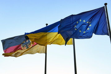 State flags of Ukraine and the Federal Republic of Germany and the flag of the European Union