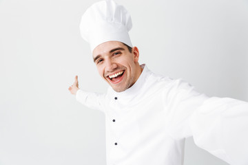Happy chef cook wearing uniform standing