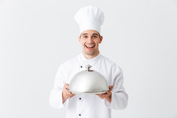Excited man chef cook wearing uniform
