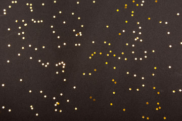 Star shaped confetti on black