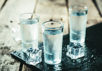 Traditional greek vodka - ouzo in shot glasses - obrazy, fototapety, plakaty