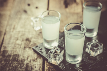 Traditional greek vodka - ouzo in shot glasses