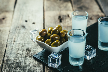 Traditional greek vodka - ouzo in shot glasses © anaumenko