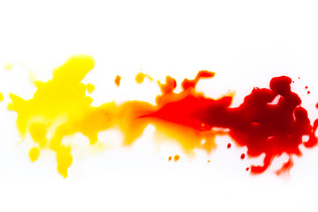 Fototapeta premium a spot of red paint on a white background.