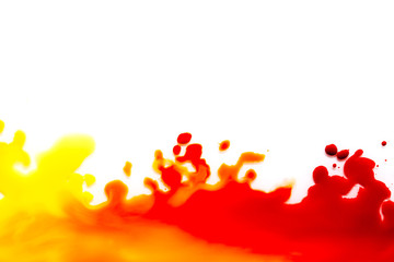 a spot of red paint on a white background.