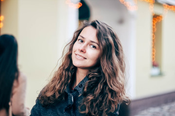  Beautiful long-haired girl in the festive Christmas town.