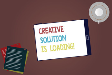 Word writing text Creative Solution Is Loading. Business concept for Inspiration Original ideas in process Tablet Empty Screen Cup Saucer and Filler Sheets on Blank Color Background