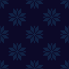Fototapeta na wymiar Knitted Norwegian snowflakes. Seamless vector background. Folk motives. Winter pattern. Can be used for wallpaper, textile, invitation card, wrapping, web page background.