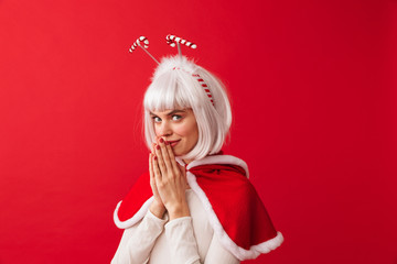 Beautiful young girl wearing red Christmas costume